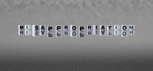 misappropriation word or concept represented by black and white letter cubes on a grey horizon...