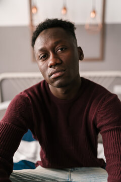 Upset African American male looking at camera