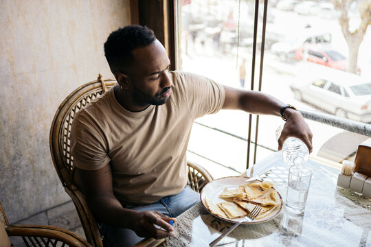 Man eating in a restaurant