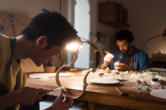 Violin luthiers creating premium musical instruments 