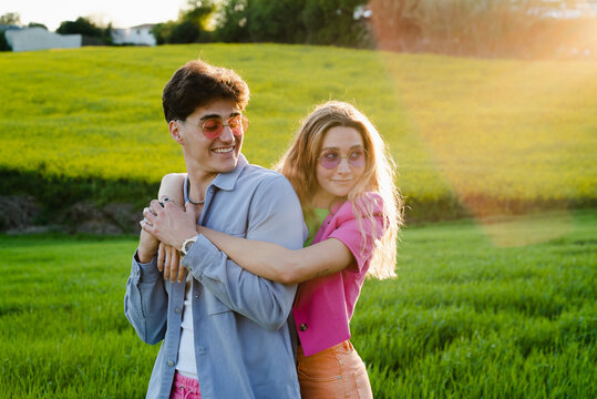 Fashionable And Stylish Couple Embracing In Nature