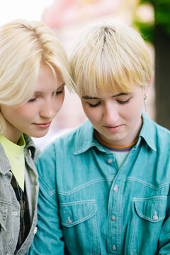 Concentrated women observing something with attention 