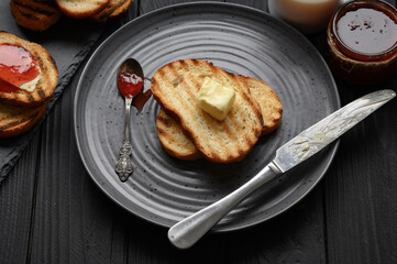 Continental Breakfast meal served with coffee, toast, jam and butter. Delicious coffee table.