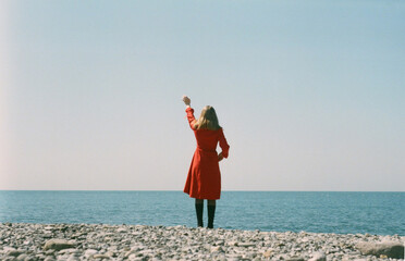A woman saying goodbye