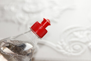 Bottle with acrylic, versatile glue designed for repair work, stands against the background of...
