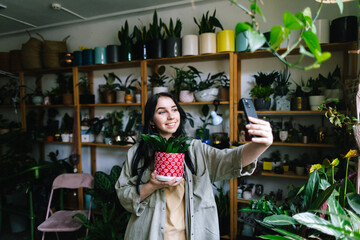 Female influencer creating content in garden store 