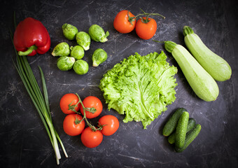 Fresh different vegetables on dark background