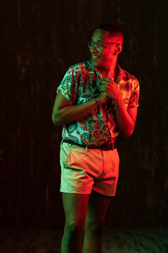 Hispanic male in neon lights at studio