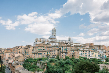 Fototapeta na wymiar View of Siena, Italy and Duomo di Siena on a summer day