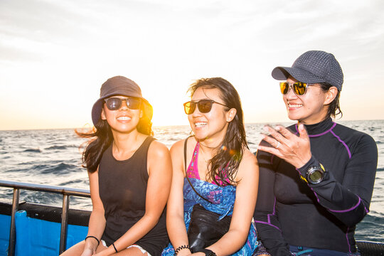 three female friends on a boat trip at Tubbataha reef