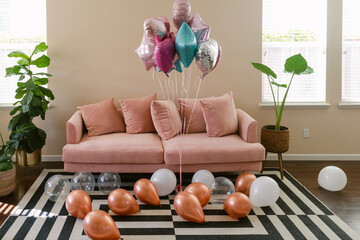 Living room full of celebration balloons