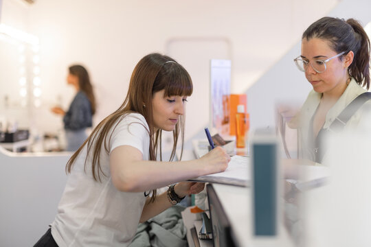 esthetician serving a client