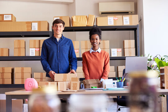 Friendly diverse colleagues in post office