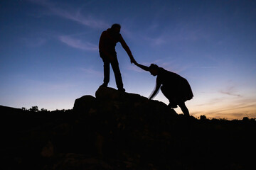 climbing on a rock to see the sunset