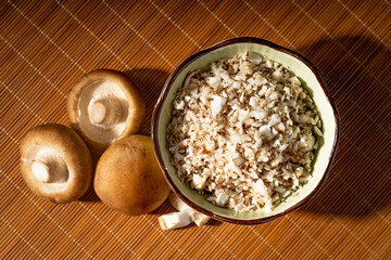 Shiitake and chopped shiitake mushrooms on a vintage background