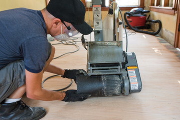 Replacing sand paper on drum sander machine