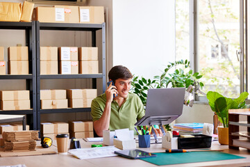 Friendly post office worker making phone call