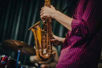Obraz premium playing the saxophone. performer plays at a concert