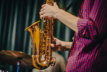 Obraz premium playing the saxophone. performer plays at a concert