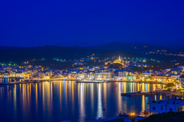 Night long exposure view of Tinos town. Centered the famous church of Panagia, Virgin Mary, illuminated at night. Tinos island Cyclades, Greece.