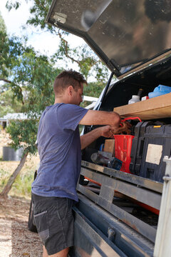 Work Man Packing Up Work Tools Into Truck