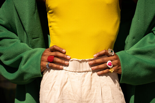 Cropped black man wearing rings and colorful apparel