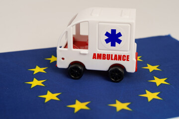 There is a toy ambulance on the flag of the European Union.