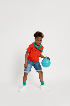 Happy boy bouncing ball