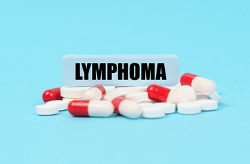 On the blue surface of the pills, capsules and a plate with the inscription - LYMPHOMA