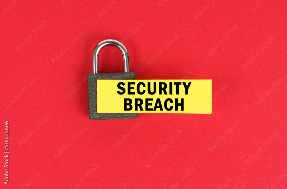 Poster on the red surface there is a lock with a sticker with the inscription - security breach