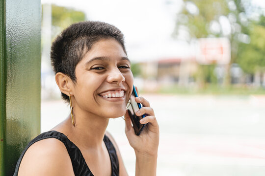 Young woman talking on a cell phone outdoors 