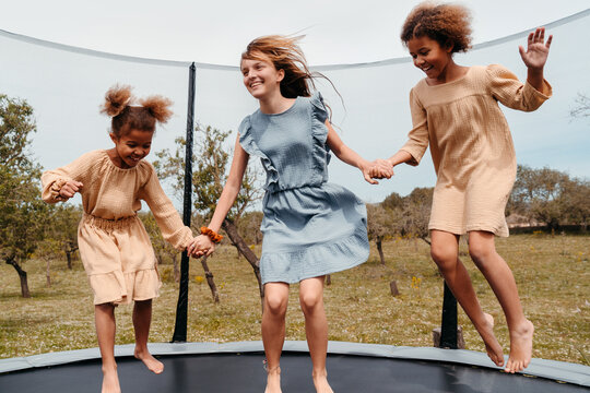 Girls playing on a trampoline