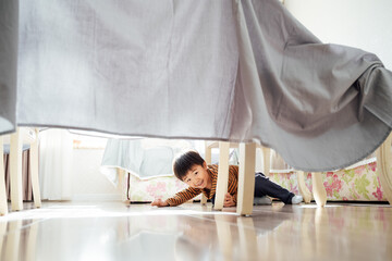 Cute boy playing at home