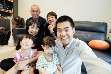 Cheerful family taking selfie