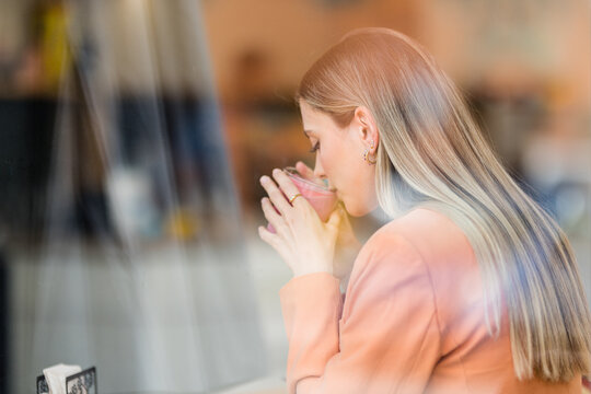 Woman Drinking Pink Latte