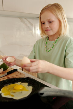 Girl Cooking Fried Eggs