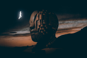 Luminous woman silhouette in front of a head