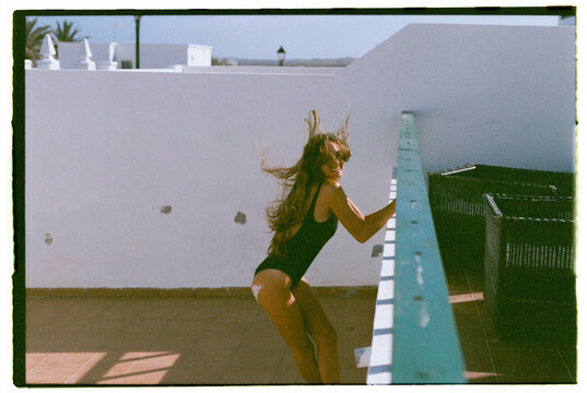 beautiful blonde woman on the terrace of her hous