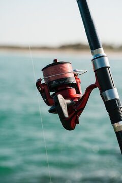 Modern fishing rod with line around reel