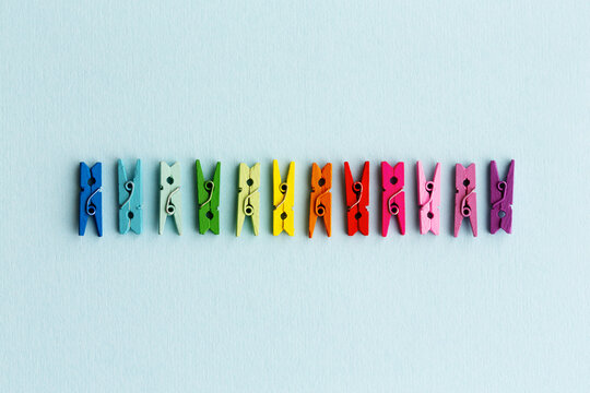 Row of rainbow colored clothespins