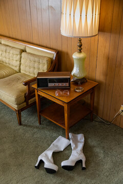 Wood Paneling in vintage Retro home with radio and high heel boots