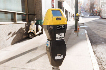 Yellow and black parking meter