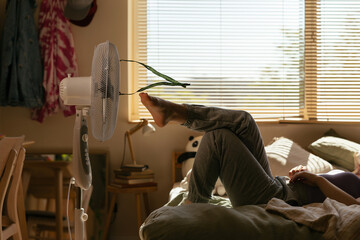 Teen resting on bed in own room