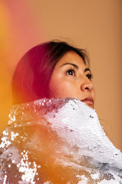 Pretty woman with sequin cape colorful portrait