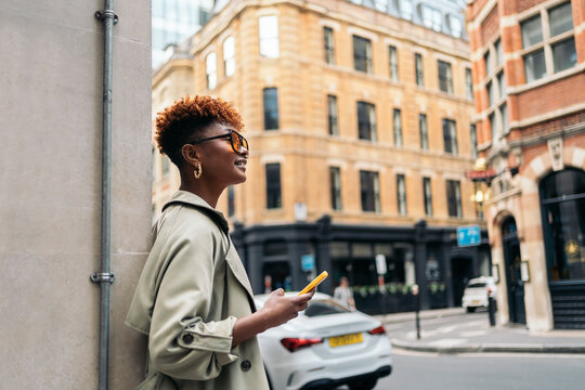 Trendy woman using mobile phone