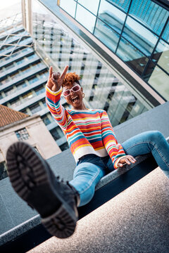 Woman in crazy gesture while laughing