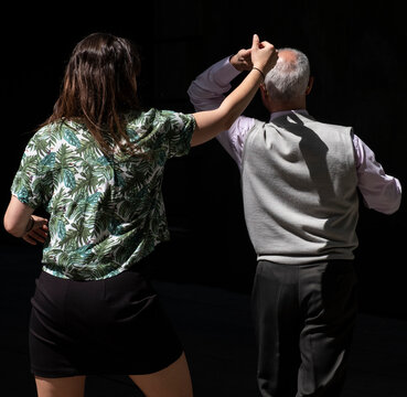 Couple swing dancing.