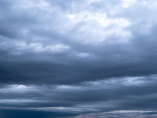 Naklejka na ściany i meble dramatic skyscape with dark ominous storm clouds
