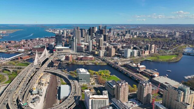 Boston downtown financial district skyline and Leonard Zakim Bridge aerial view, with Boston Harbor and Charles River at the background, Boston, Massachusetts MA, USA. 