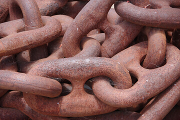 Close-up view of a very heavy old and rusty anchor chain